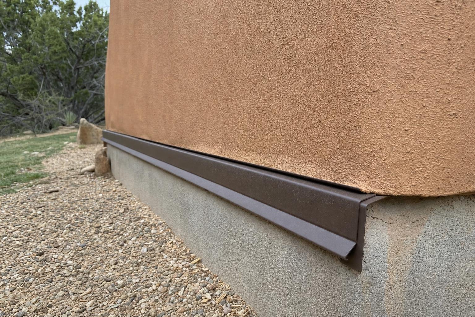 Photo of stucco flashing and drainage repair work
